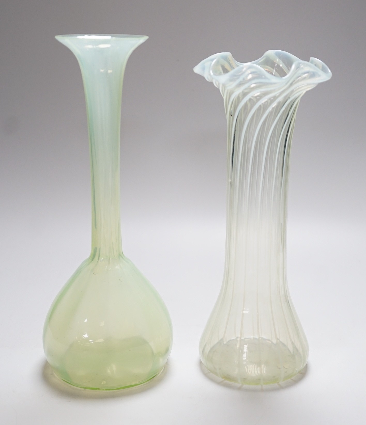 Two Victorian vaseline glass vases, tallest 27cms